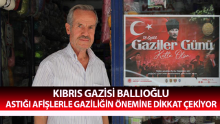 Astığı afişlerle gaziliğin önemine dikkat çekiyor