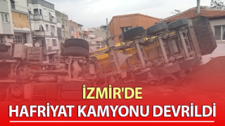 Hafriyat kamyonu yük boşalttığı esnada devrildi