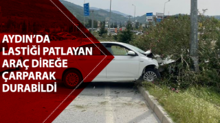 Söke'de lastiği patlayan araç refüjdeki aydınlatma direğine çarparak durabildi